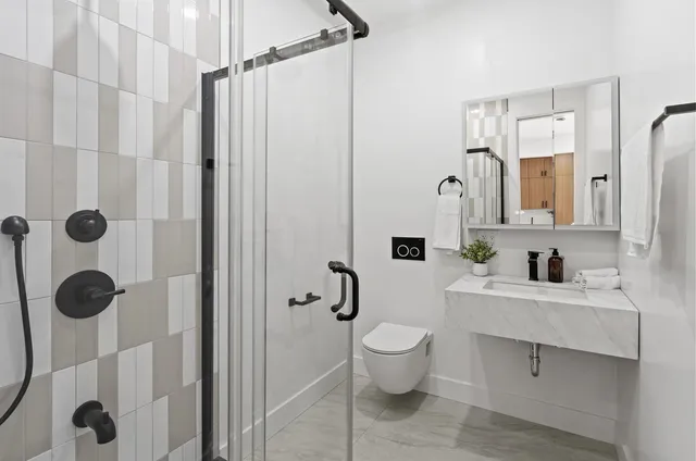 a bedroom with a bed and large window