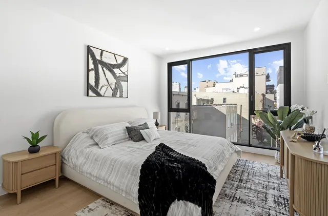 a bathroom with a toilet sink and shower