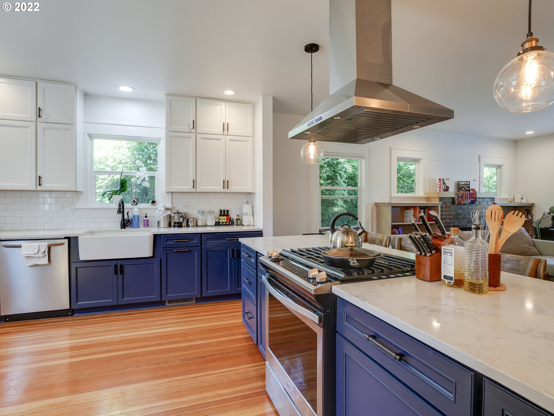 6676 North Mears Street Portland, OR 97203 - Photo 4 of 21 a kitchen with stainless steel appliances granite countertop a stove a sink dishwasher and a microwave oven with cabinets