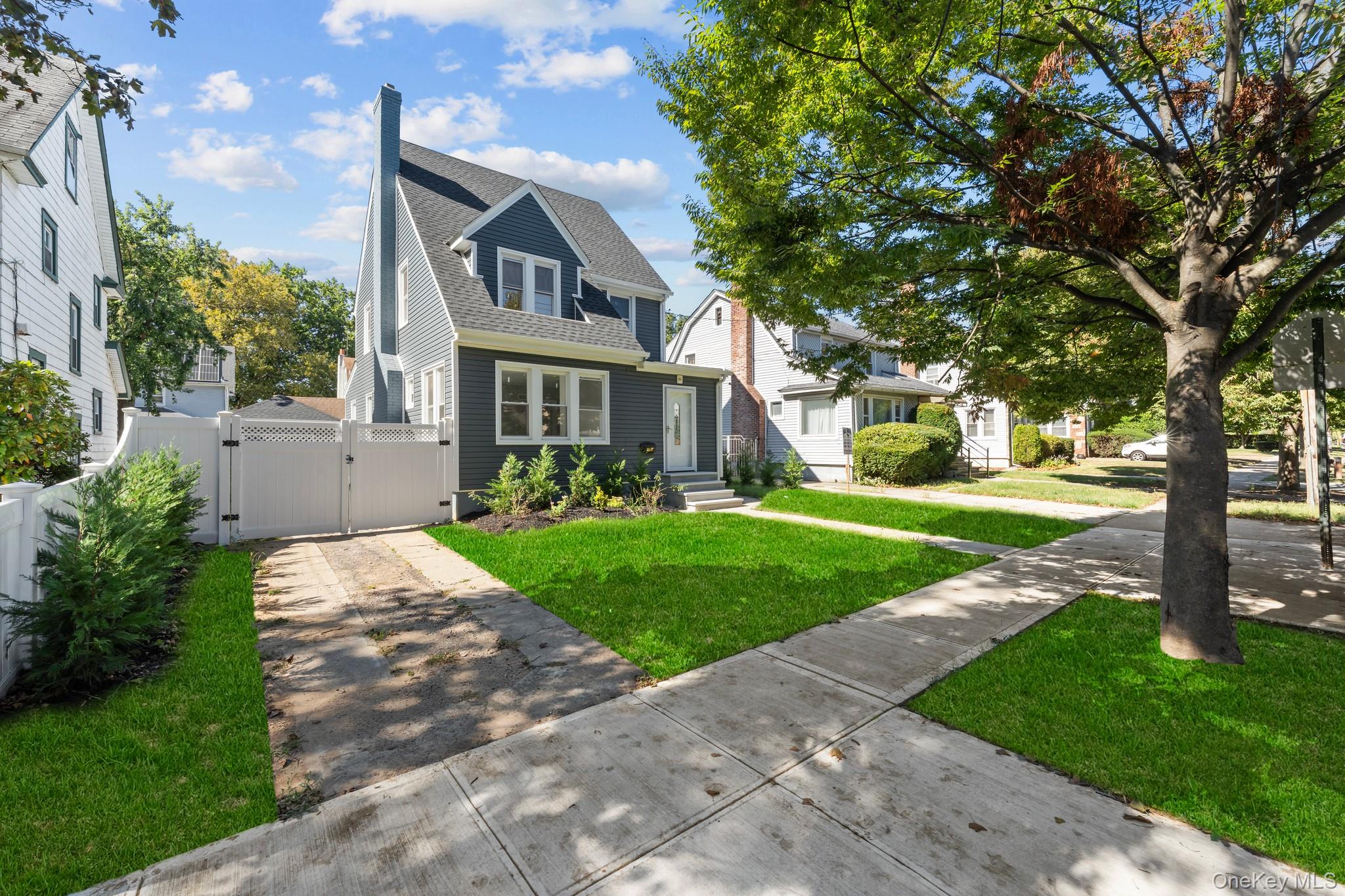 111-32 199th Street Queens, NY 11412 - Photo 17 of 19 View of front of house with a gate and roof with shingles