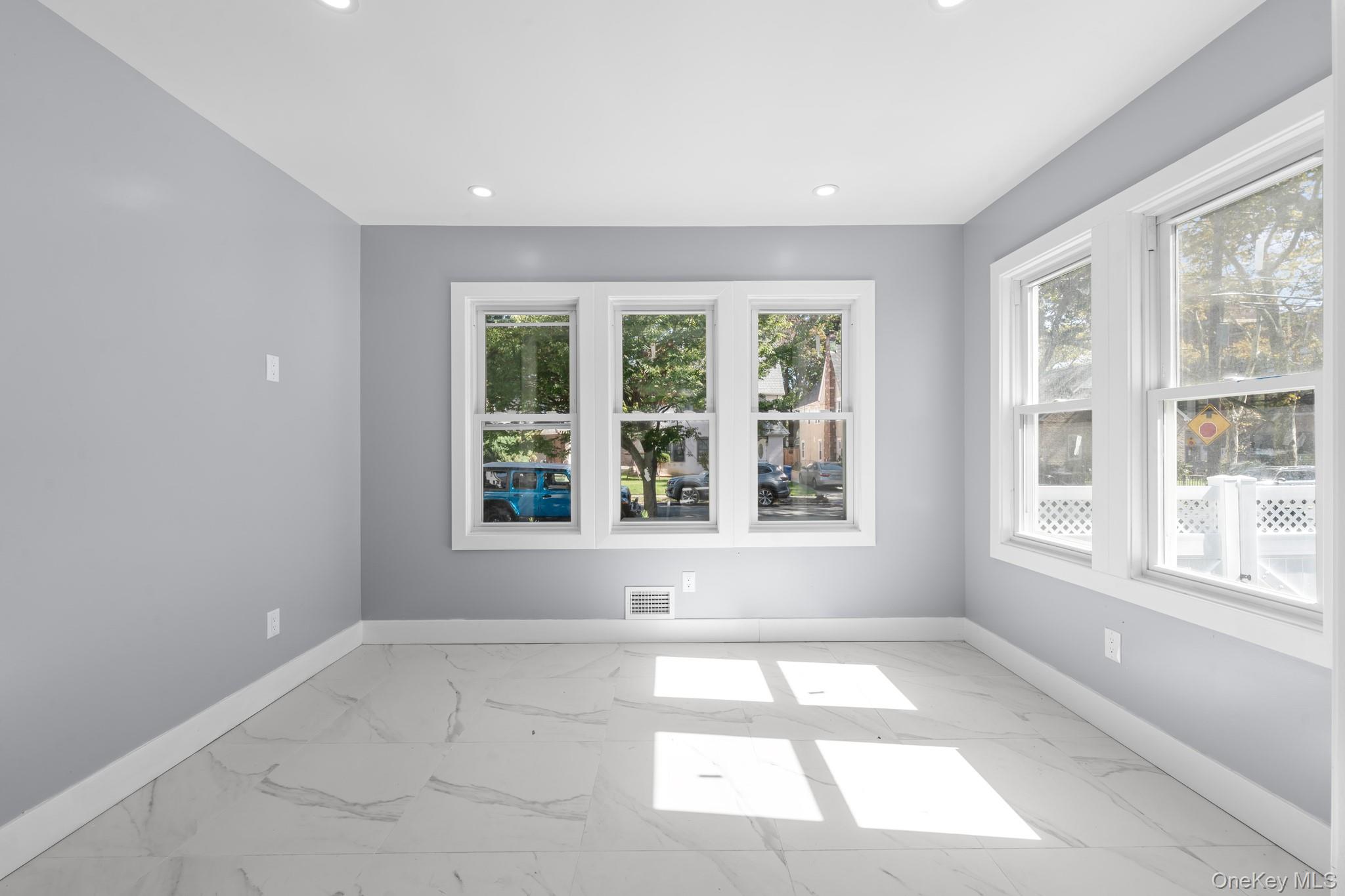 111-32 199th Street Queens, NY 11412 - Photo 6 of 19 Unfurnished room with light marble finish flooring and recessed lighting