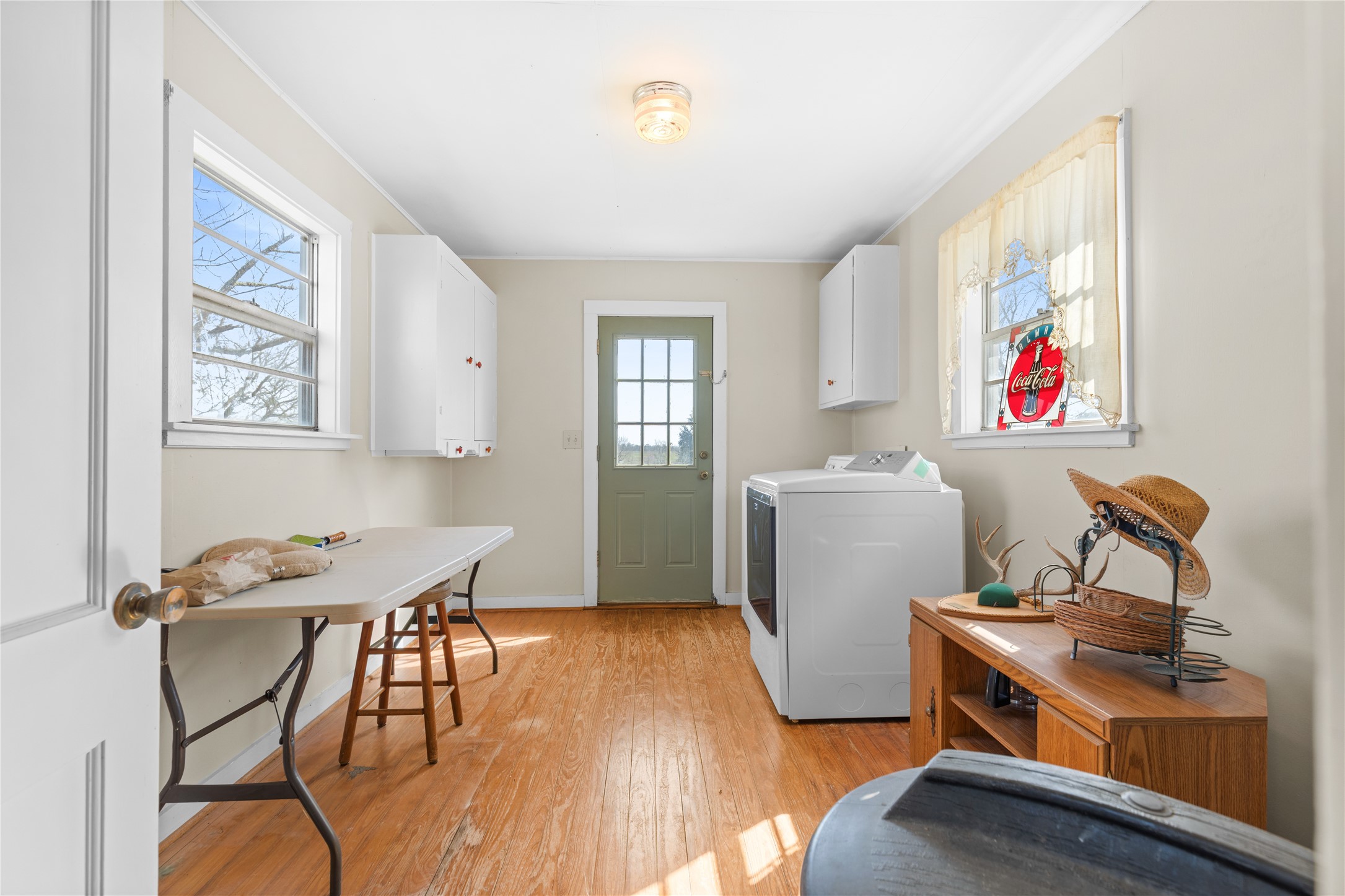 18218 Buck Road Washington, TX 77880 - Photo 12 of 32 a view of a workspace with furniture and a window