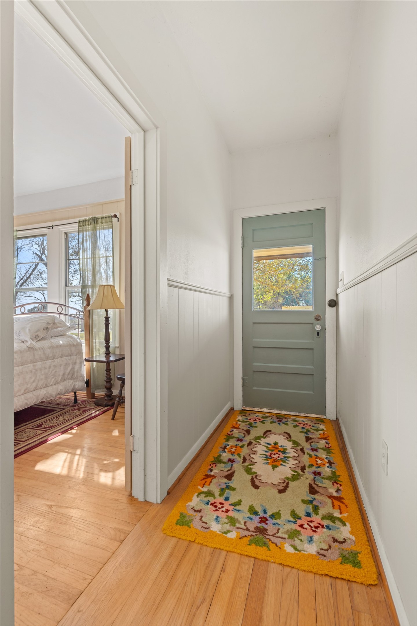 18218 Buck Road Washington, TX 77880 - Photo 13 of 32 a view of a hallway to a livingroom with wooden floor