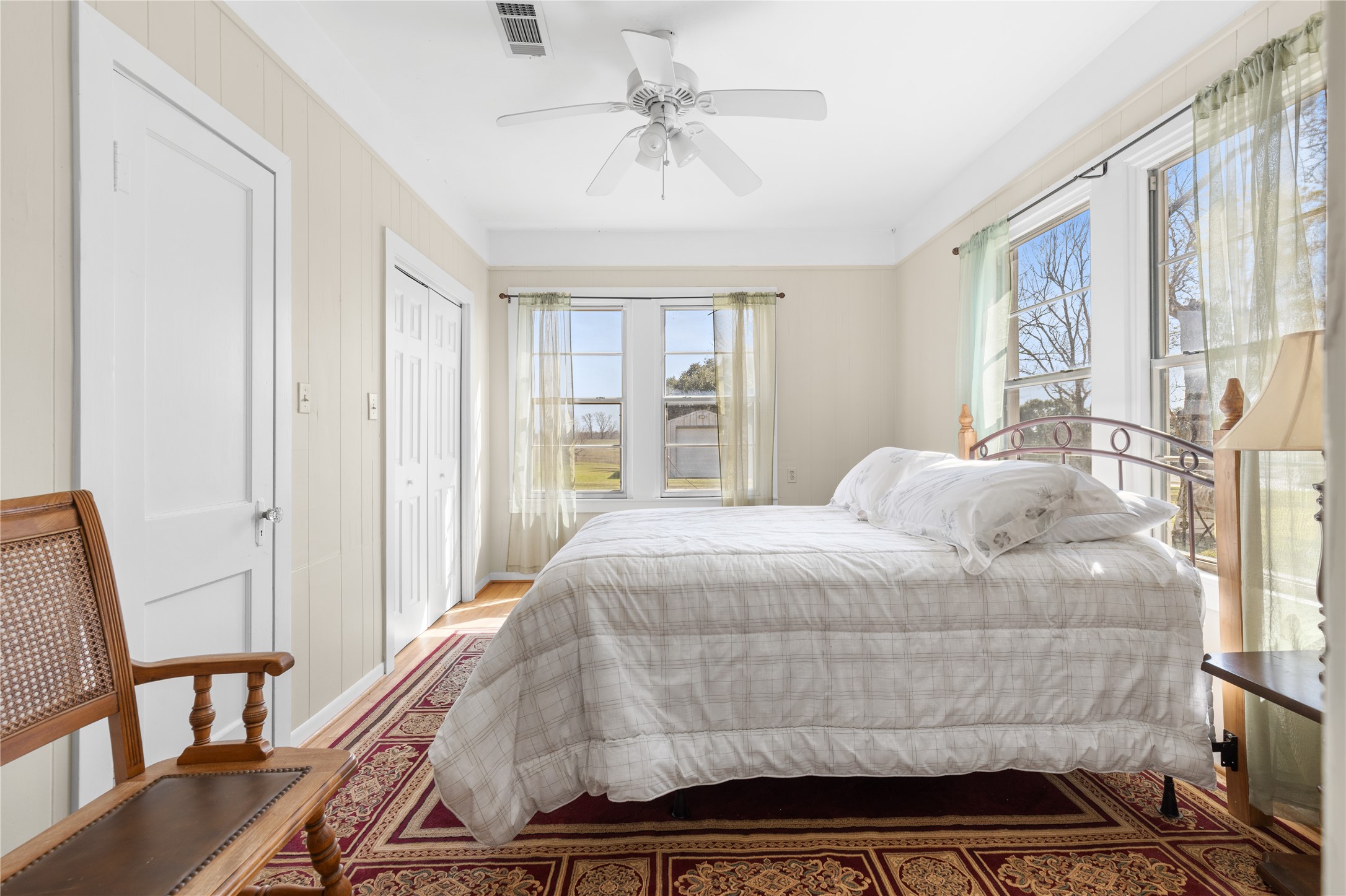 18218 Buck Road Washington, TX 77880 - Photo 14 of 32 a bedroom with a large bed and a window