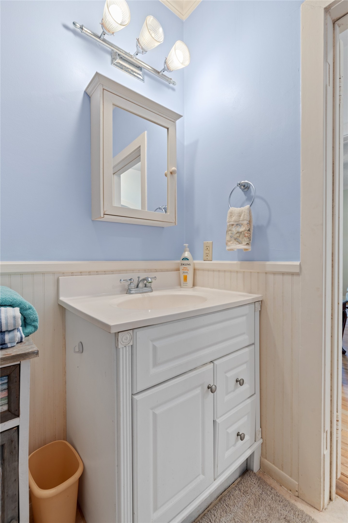 18218 Buck Road Washington, TX 77880 - Photo 18 of 32 a bathroom with a toilet sink and mirror