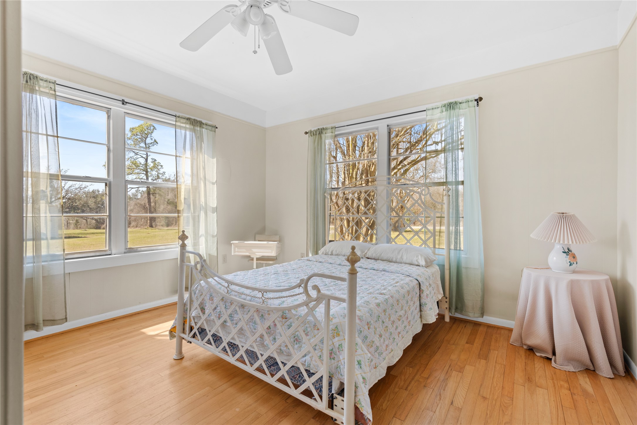 18218 Buck Road Washington, TX 77880 - Photo 19 of 32 a bedroom with a bed and a large window