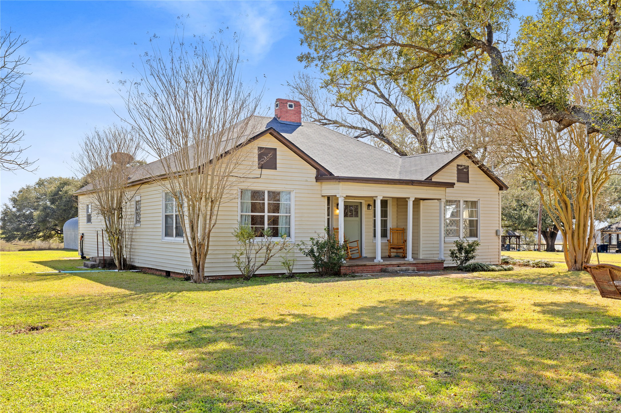 18218 Buck Road Washington, TX 77880 - Photo 2 of 32 a front view of a house with a yard
