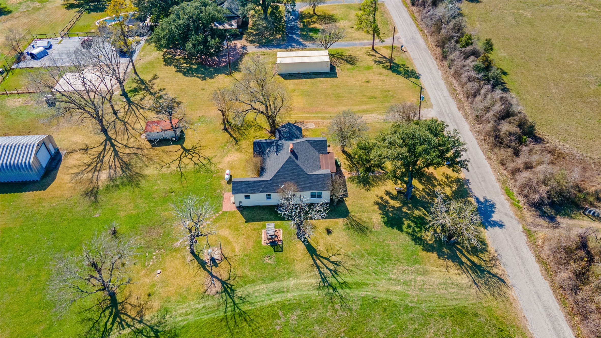 18218 Buck Road Washington, TX 77880 - Photo 31 of 32 an aerial view of residential houses with yard