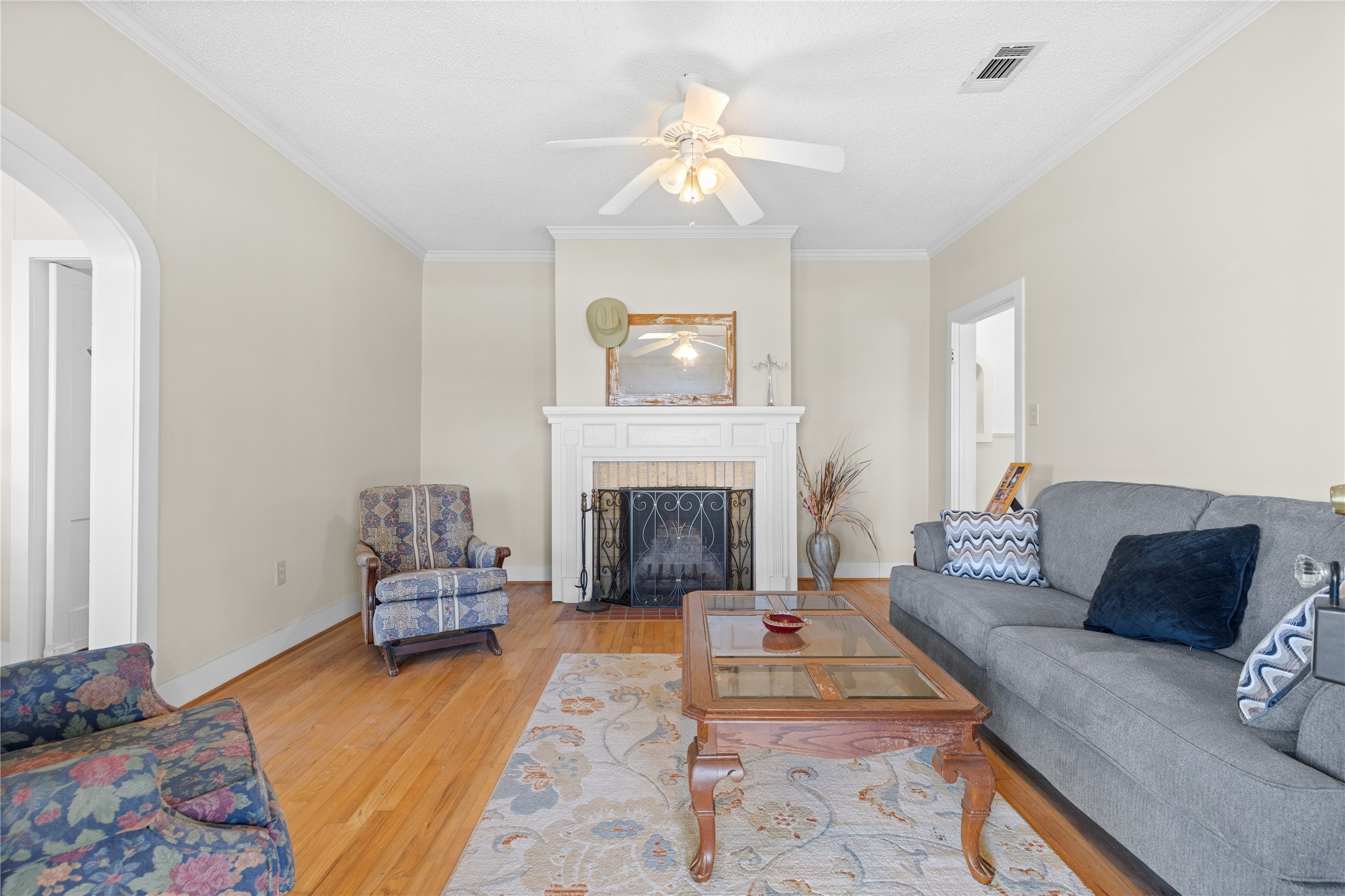 18218 Buck Road Washington, TX 77880 - Photo 6 of 32 a living room with furniture and a fireplace
