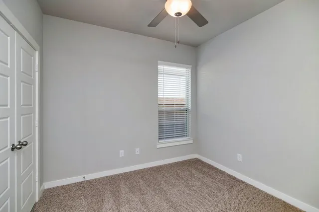 an empty room with a empty space and a window