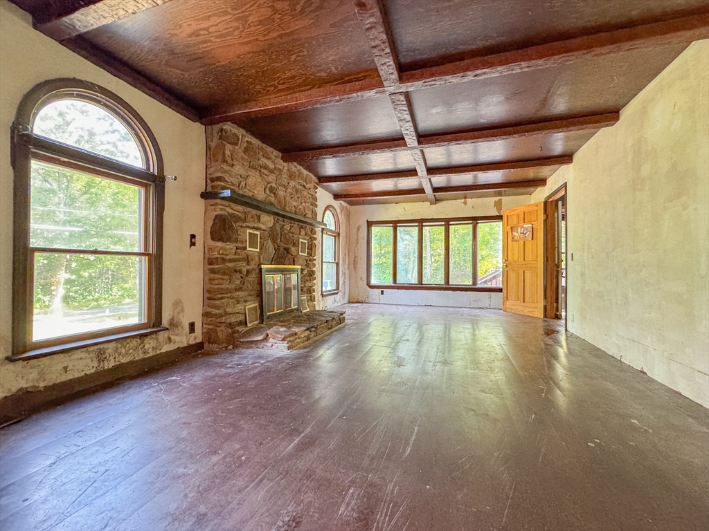 198 Union Road Wales, MA 01081 - Photo 27 of 42 a view of an empty room with a window and wooden floor