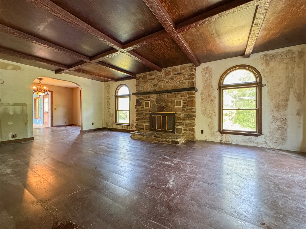 198 Union Road Wales, MA 01081 - Photo 28 of 42 a view of empty room with wooden floor and fireplace