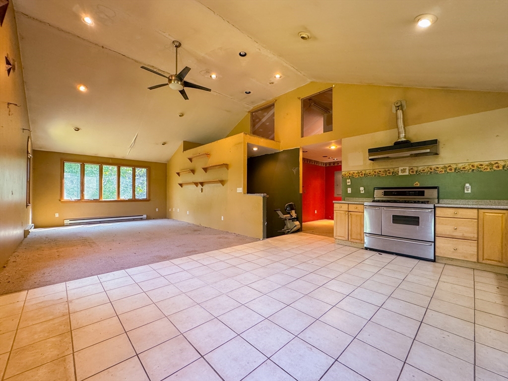 198 Union Road Wales, MA 01081 - Photo 40 of 42 a large kitchen with stainless steel appliances kitchen island granite countertop a sink and cabinets