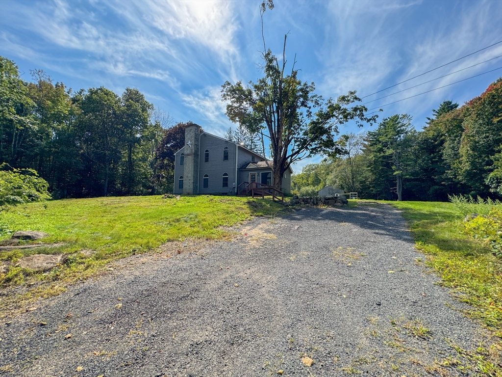 198 Union Road Wales, MA 01081 - Photo 9 of 42 a view of a yard with a house
