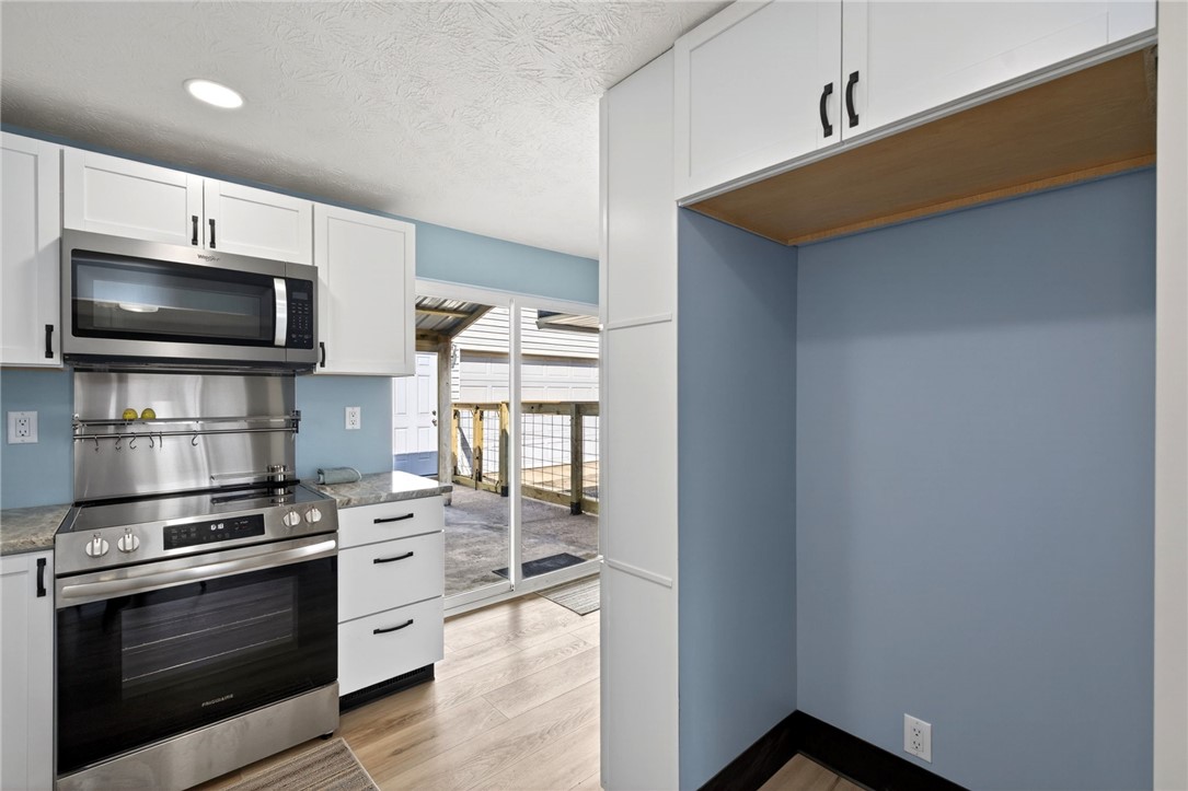 5975 Rosalie Road Dayton, OH 45424 - Photo 9 of 48 This modern kitchen features sleek appliances and ample cabinet space, perfect for culinary adventures.