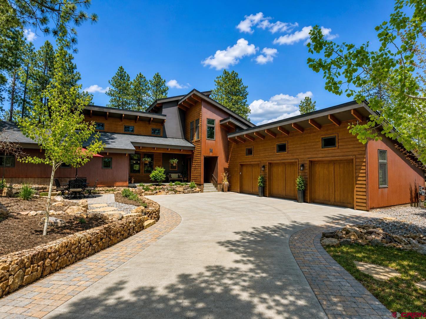 24 Monarch Crest Trail Durango, CO 81301 - Photo 2 of 45 a front view of a house with a yard and garage