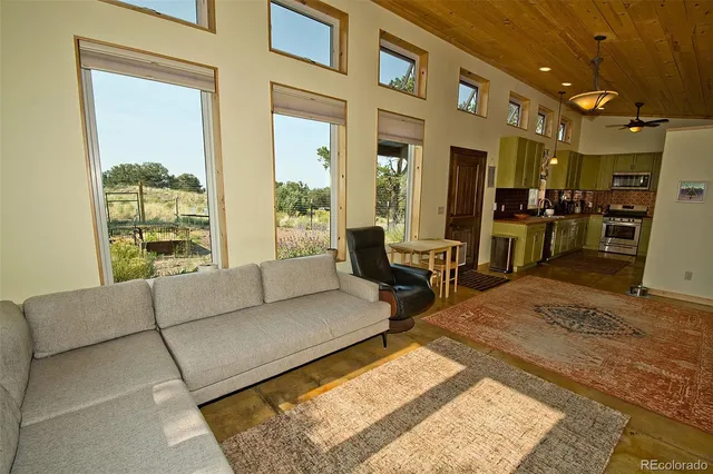 a living room with furniture and a rug