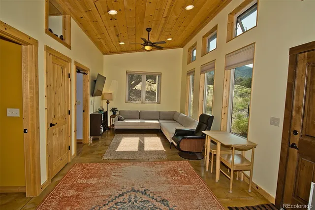 a living room with furniture and a rug