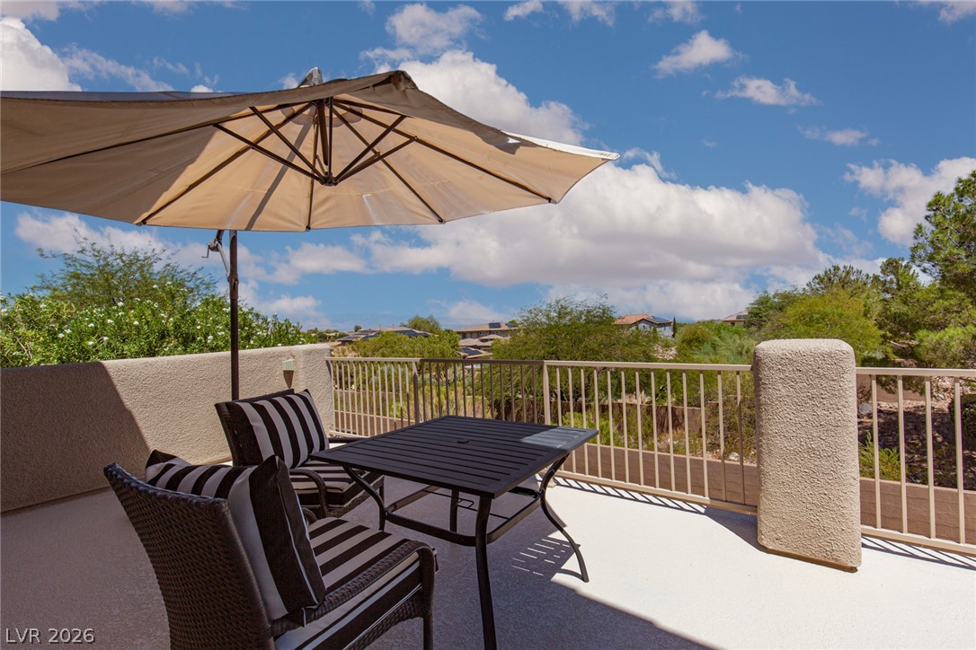 22 Douglas Grove Road Henderson, NV 89052 - Photo 48 of 72 Unwind outdoors on this charming patio, complete with privacy and verdant hillside views.