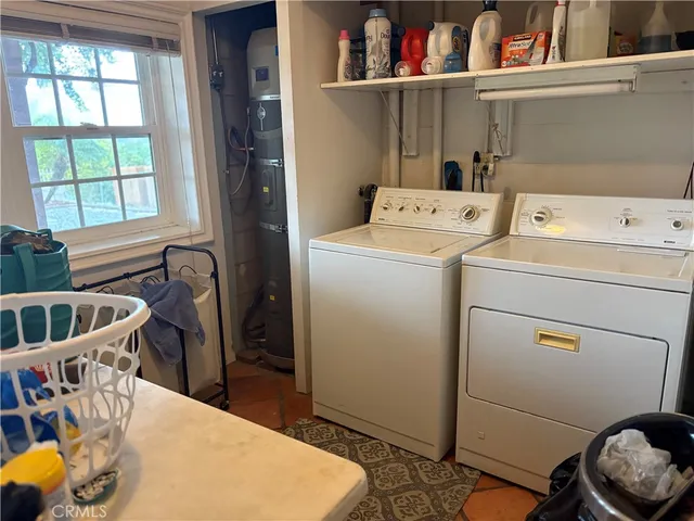 a bathroom with a sink and mirror with toilet