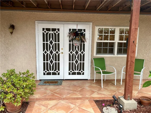 a bedroom with furniture and a window