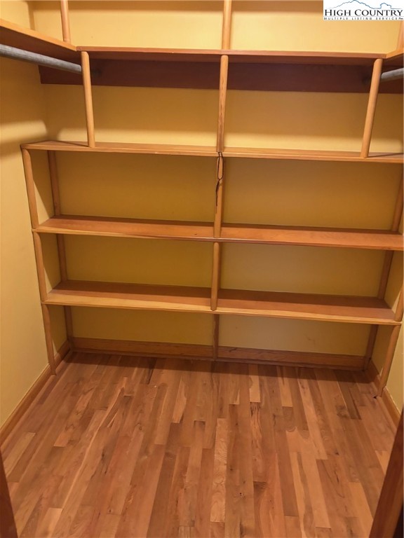 94 Kemp Street Sparta, NC 28675 - Photo 11 of 27 a view of walk in closet with empty racks