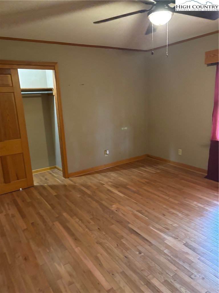 94 Kemp Street Sparta, NC 28675 - Photo 14 of 27 a view of an empty room with wooden floor