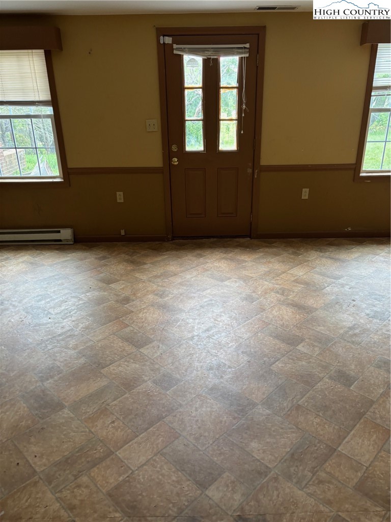 94 Kemp Street Sparta, NC 28675 - Photo 20 of 27 an empty room with windows
