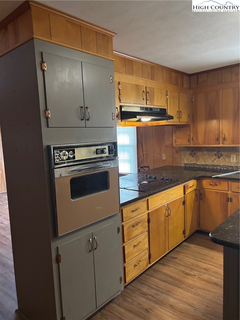 94 Kemp Street Sparta, NC 28675 - Photo 2 of 27 a kitchen with stainless steel appliances granite countertop a stove a sink and a refrigerator
