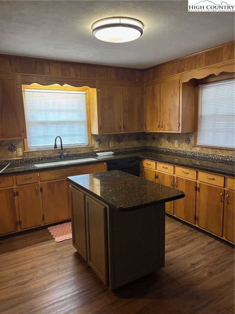 94 Kemp Street Sparta, NC 28675 - Photo 3 of 27 a kitchen with a sink and wooden cabinets