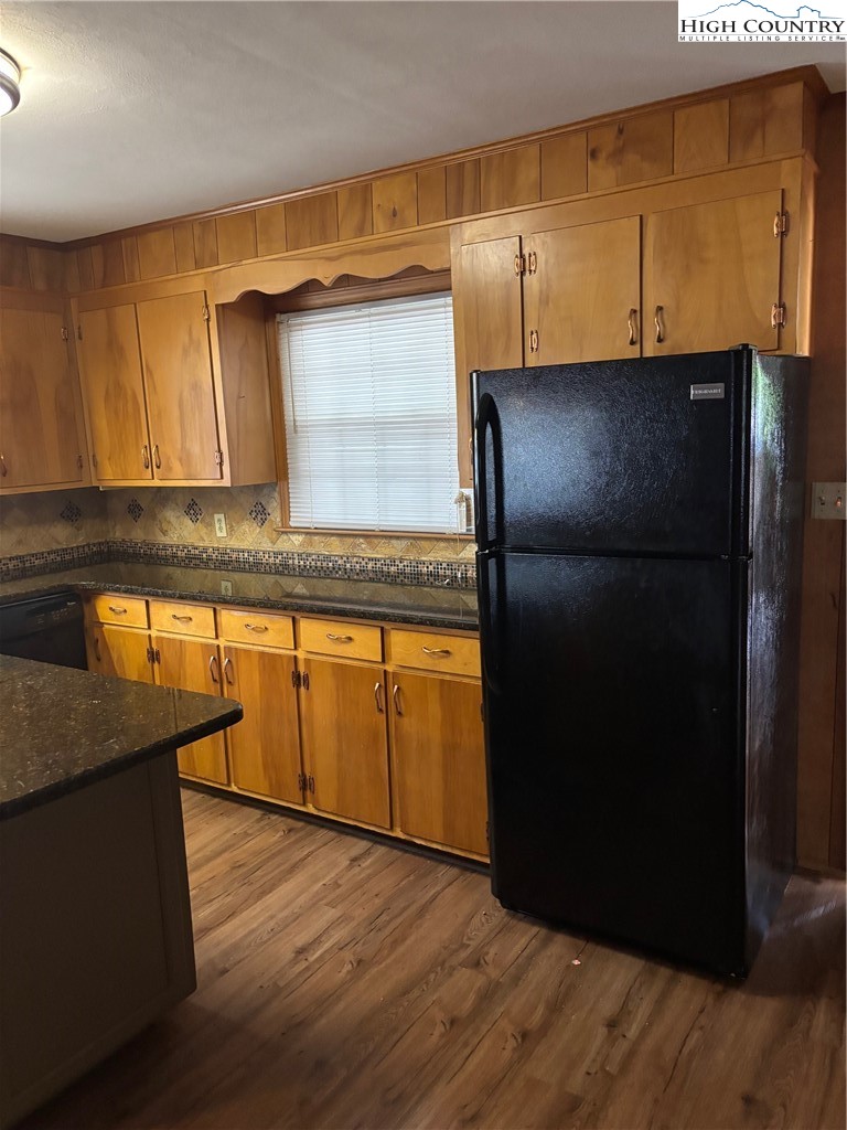 94 Kemp Street Sparta, NC 28675 - Photo 4 of 27 a kitchen with granite countertop cabinets and refrigerator