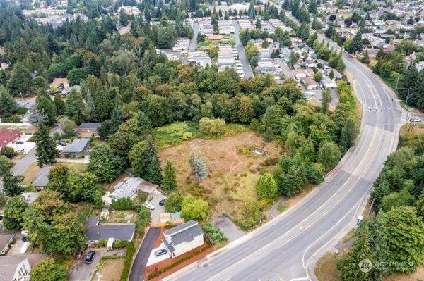 an aerial view of residential houses with green space