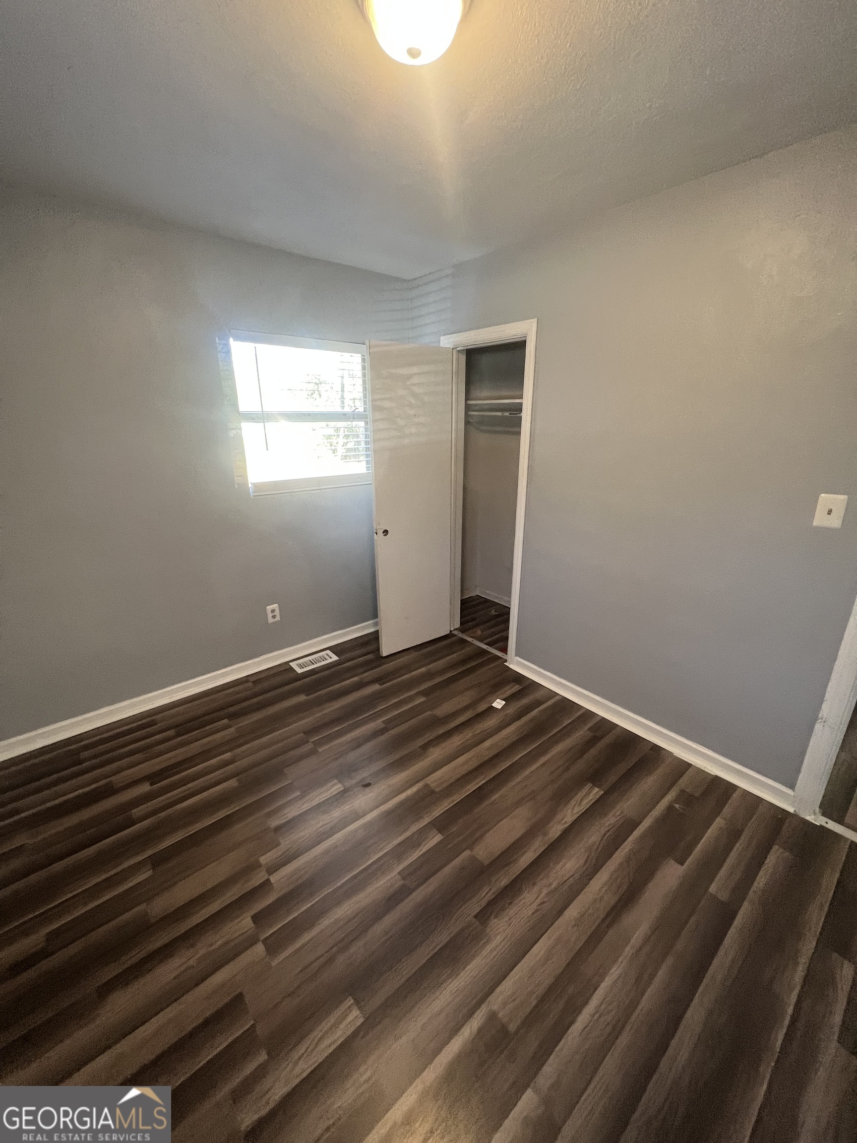 1909 West Broad Avenue Albany, GA 31707 - Photo 2 of 9 a view of room with wooden floor and window