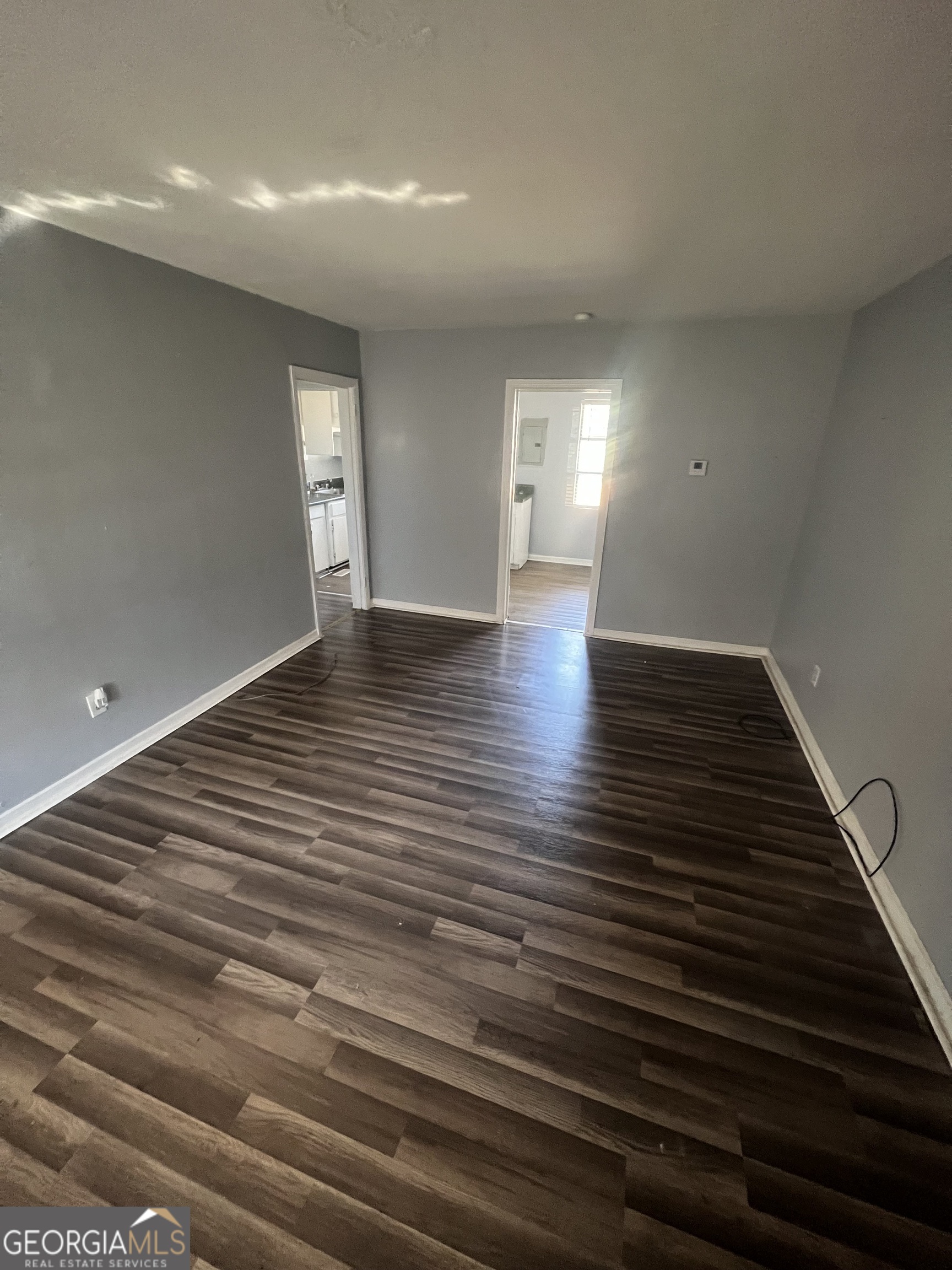 1909 West Broad Avenue Albany, GA 31707 - Photo 7 of 9 a view of wooden floor and windows in a room