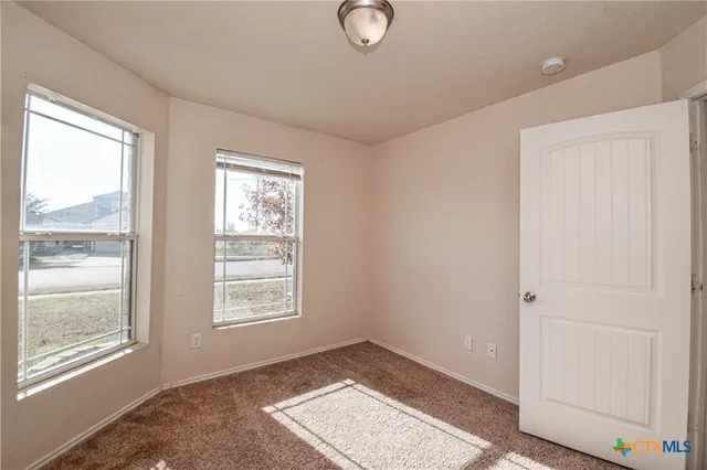 a view of an empty room and window