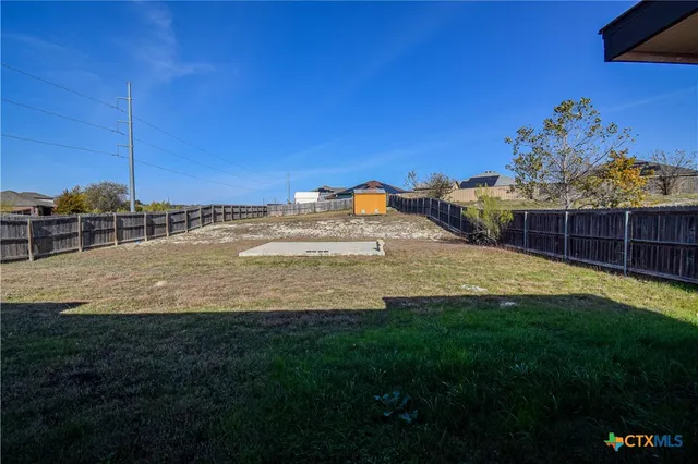 a swimming pool with wooden fence