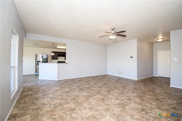 a view of a kitchen with a sink and a microwave