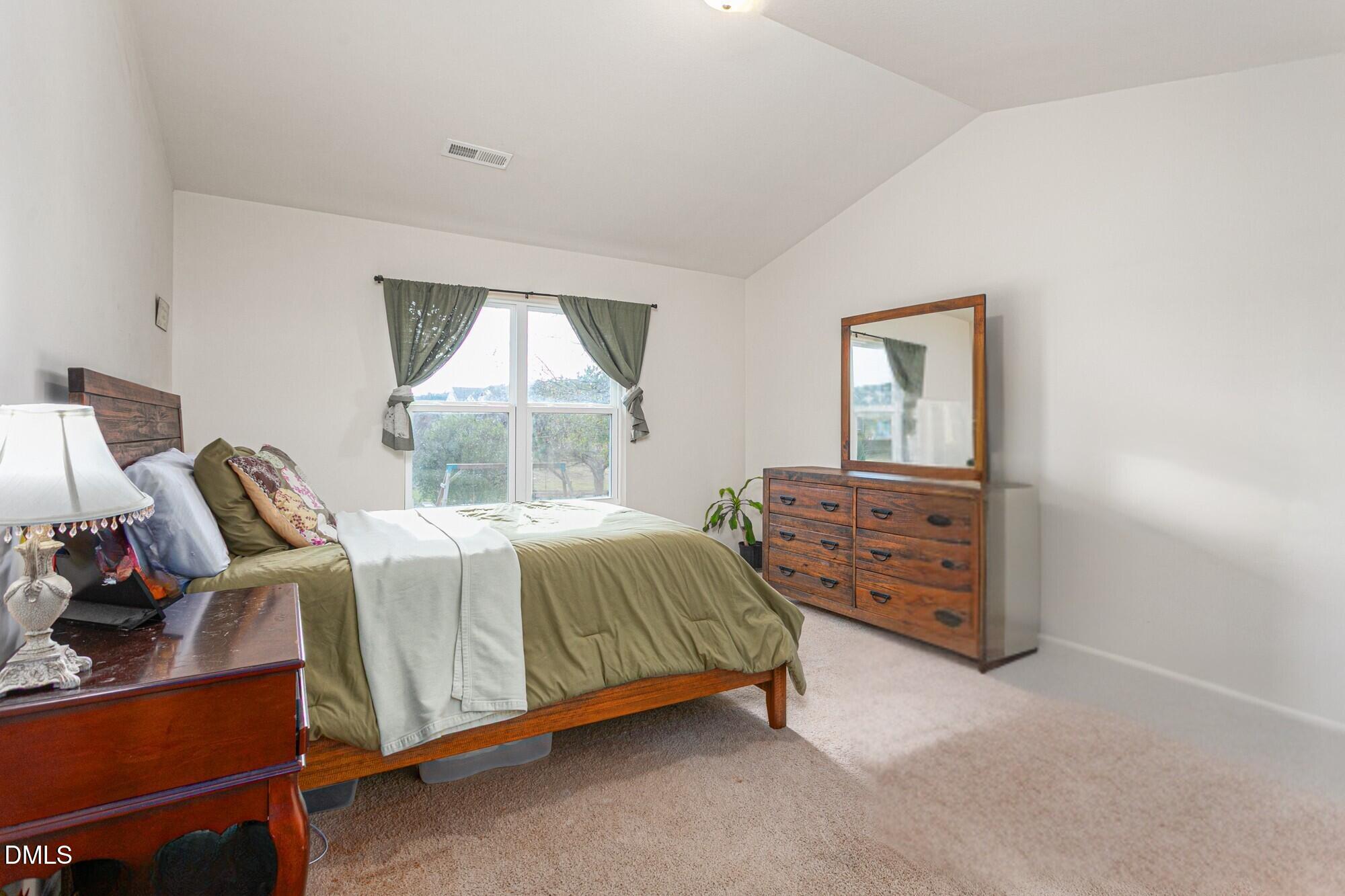 1985 Softwinds Drive Graham, NC 27253 - Photo 12 of 31 a bedroom with a bed and a window