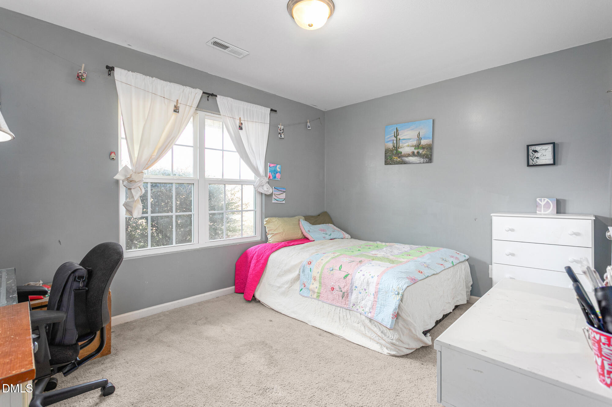 1985 Softwinds Drive Graham, NC 27253 - Photo 17 of 31 a bedroom with a bed and a window