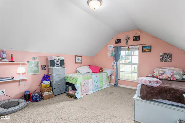 a bedroom with bed and a window