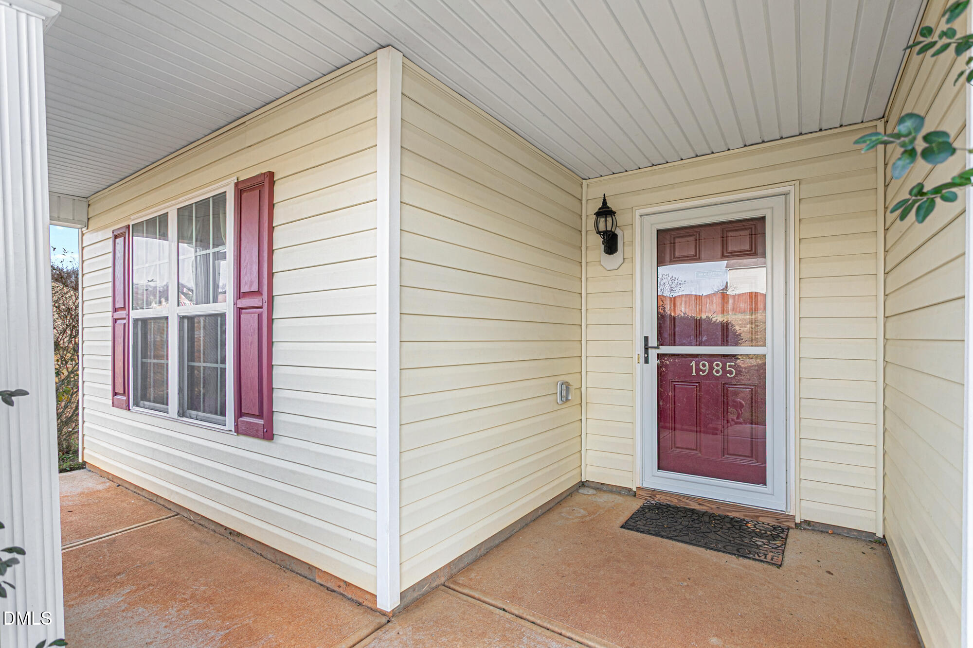 1985 Softwinds Drive Graham, NC 27253 - Photo 3 of 31 a view of a porch with a table and chair