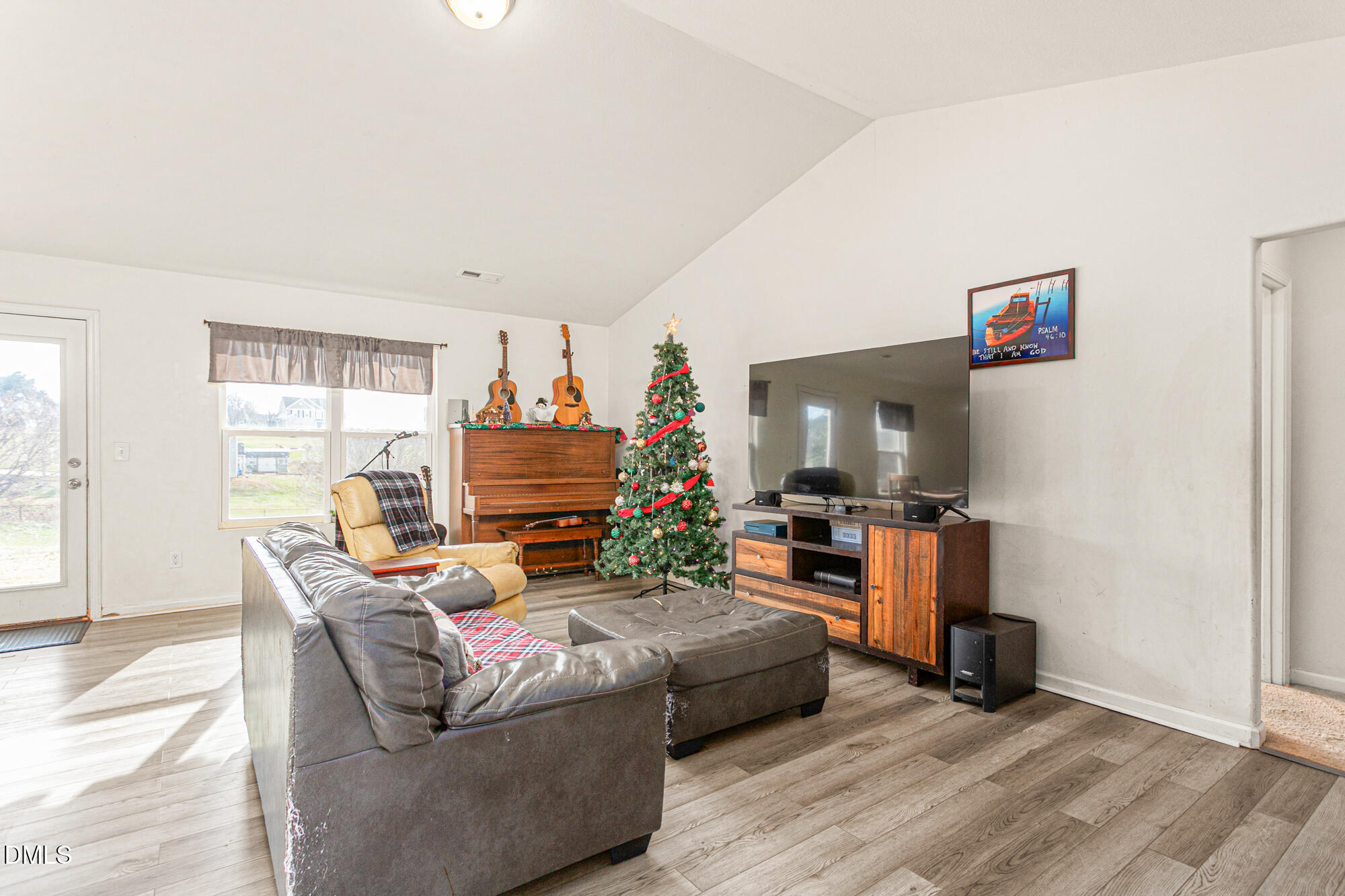 1985 Softwinds Drive Graham, NC 27253 - Photo 5 of 31 a living room with furniture and a flat screen tv