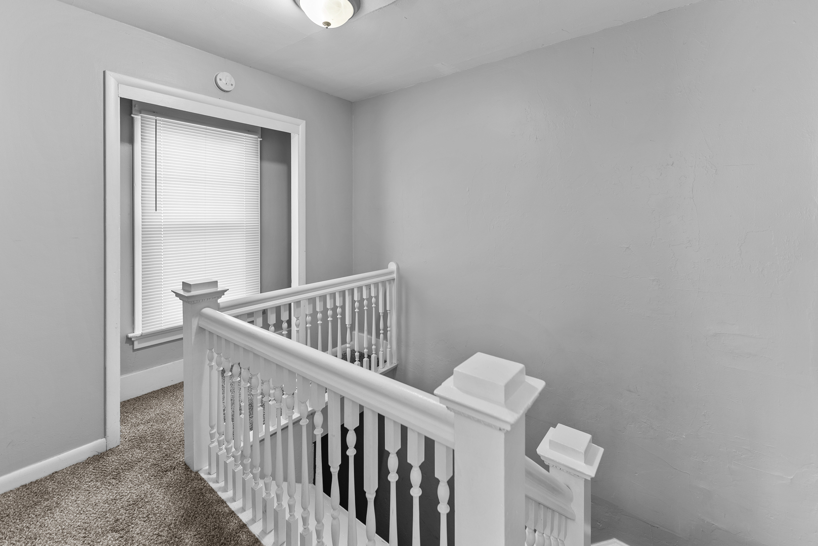 615 44th Street Rock Island, IL 61201 - Photo 11 of 22 a view of staircase with railing and white walls