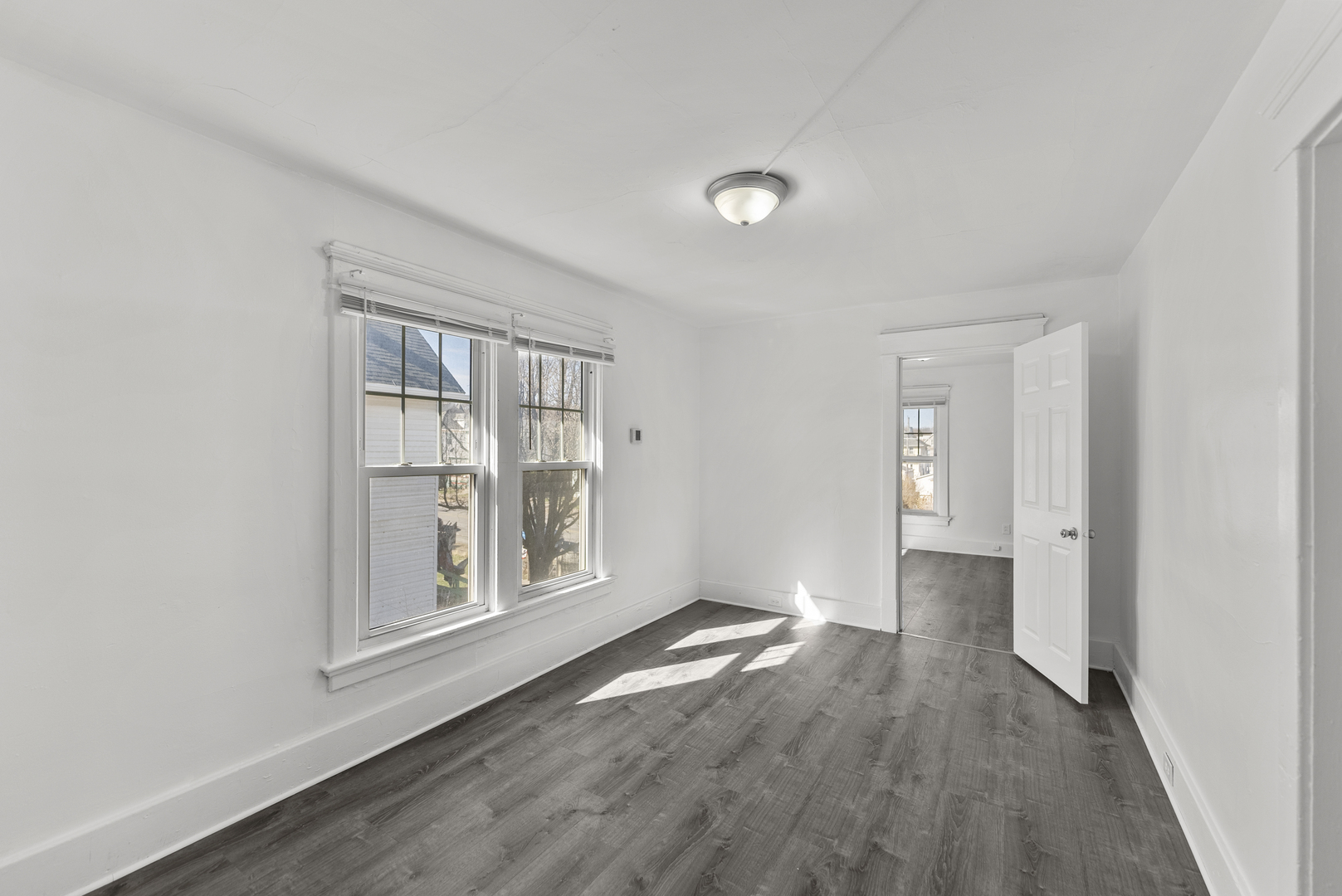 615 44th Street Rock Island, IL 61201 - Photo 15 of 22 wooden floor in an empty room with a window