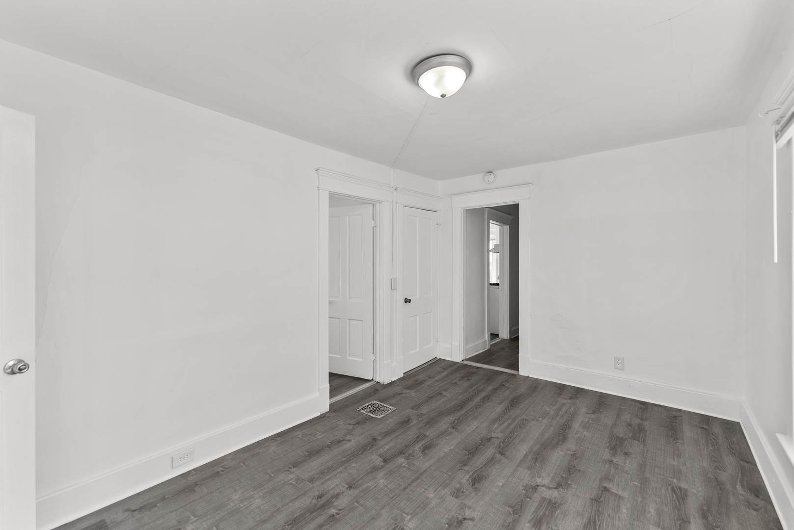 615 44th Street Rock Island, IL 61201 - Photo 16 of 22 an empty room with wooden floor and white walls