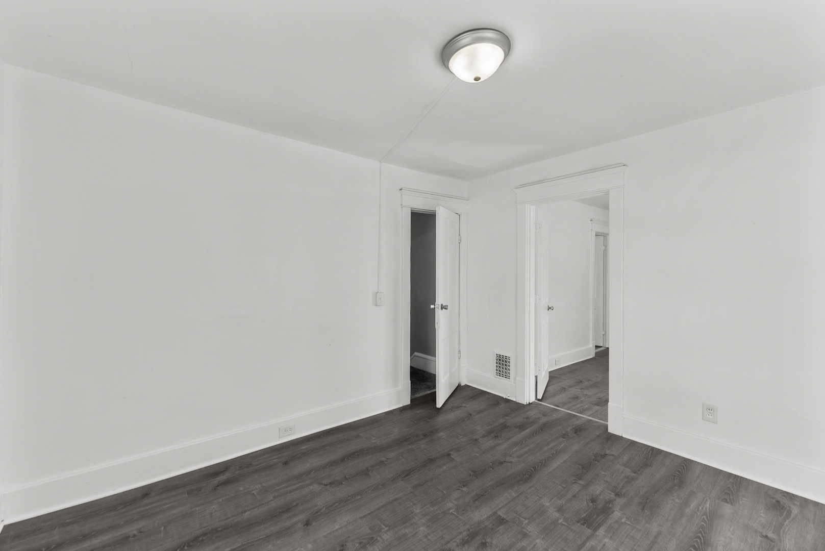 615 44th Street Rock Island, IL 61201 - Photo 18 of 22 an empty room with wooden floor and windows