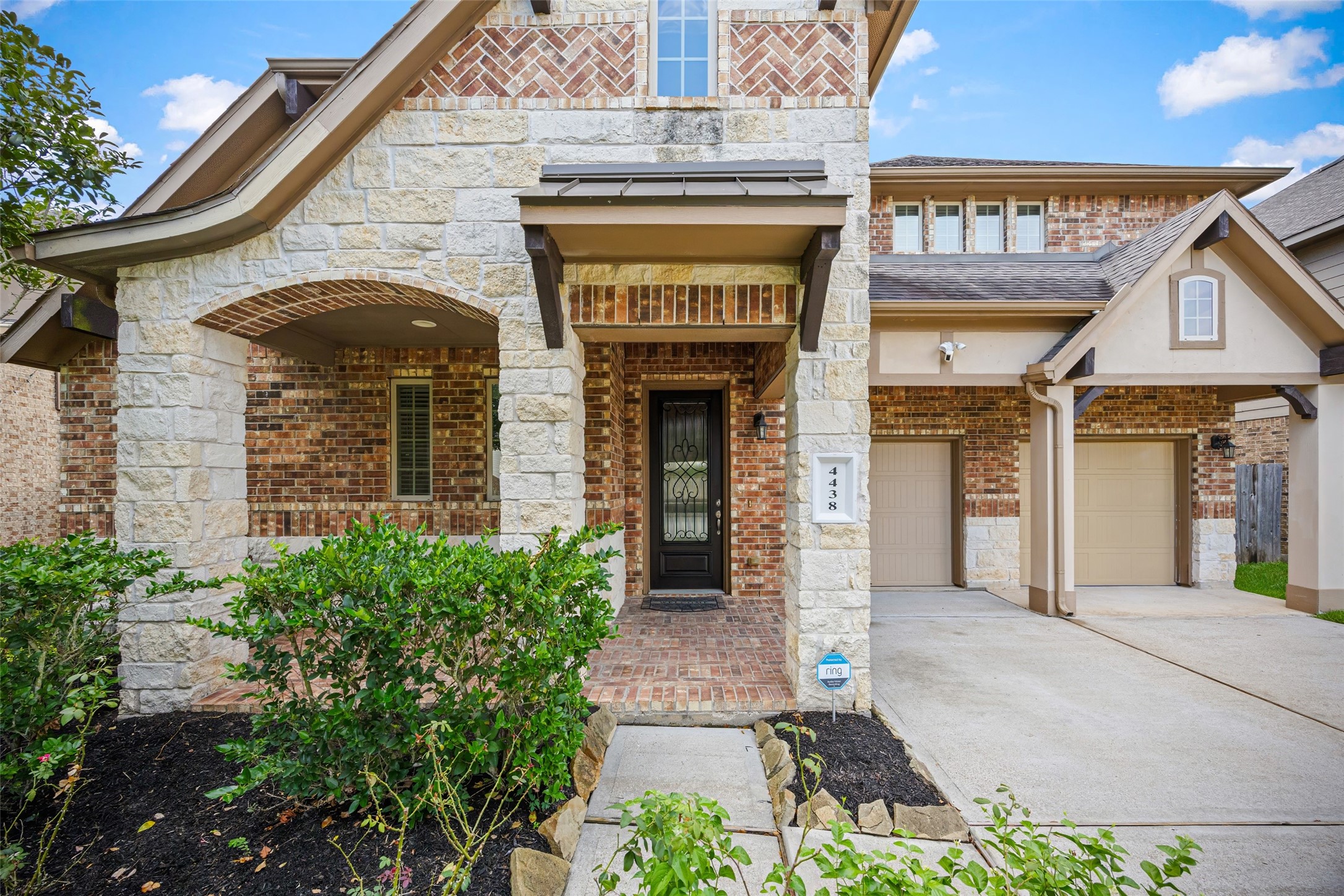 4438 Selwyn Road Richmond, TX 77407 - Photo 2 of 23 a front view of a house with garden