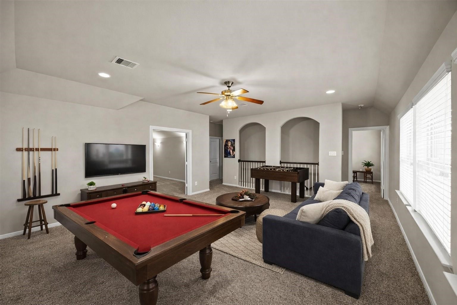 4438 Selwyn Road Richmond, TX 77407 - Photo 9 of 23 a living room with furniture pool table and flat screen tv