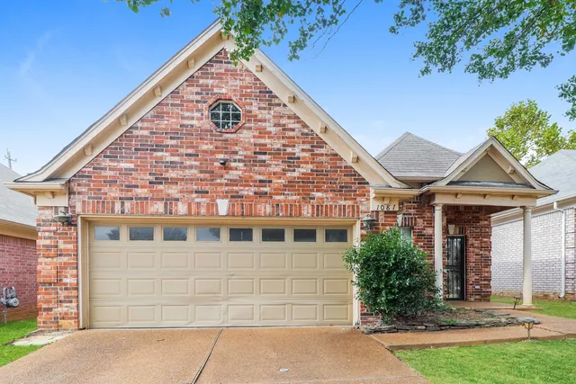 a view of empty room with a fireplace