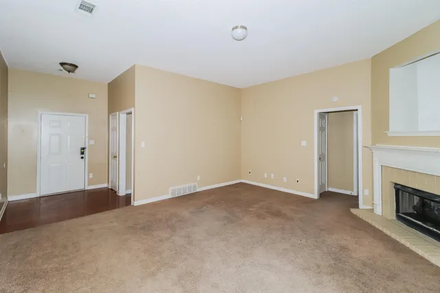 a view of a livingroom with a kitchen